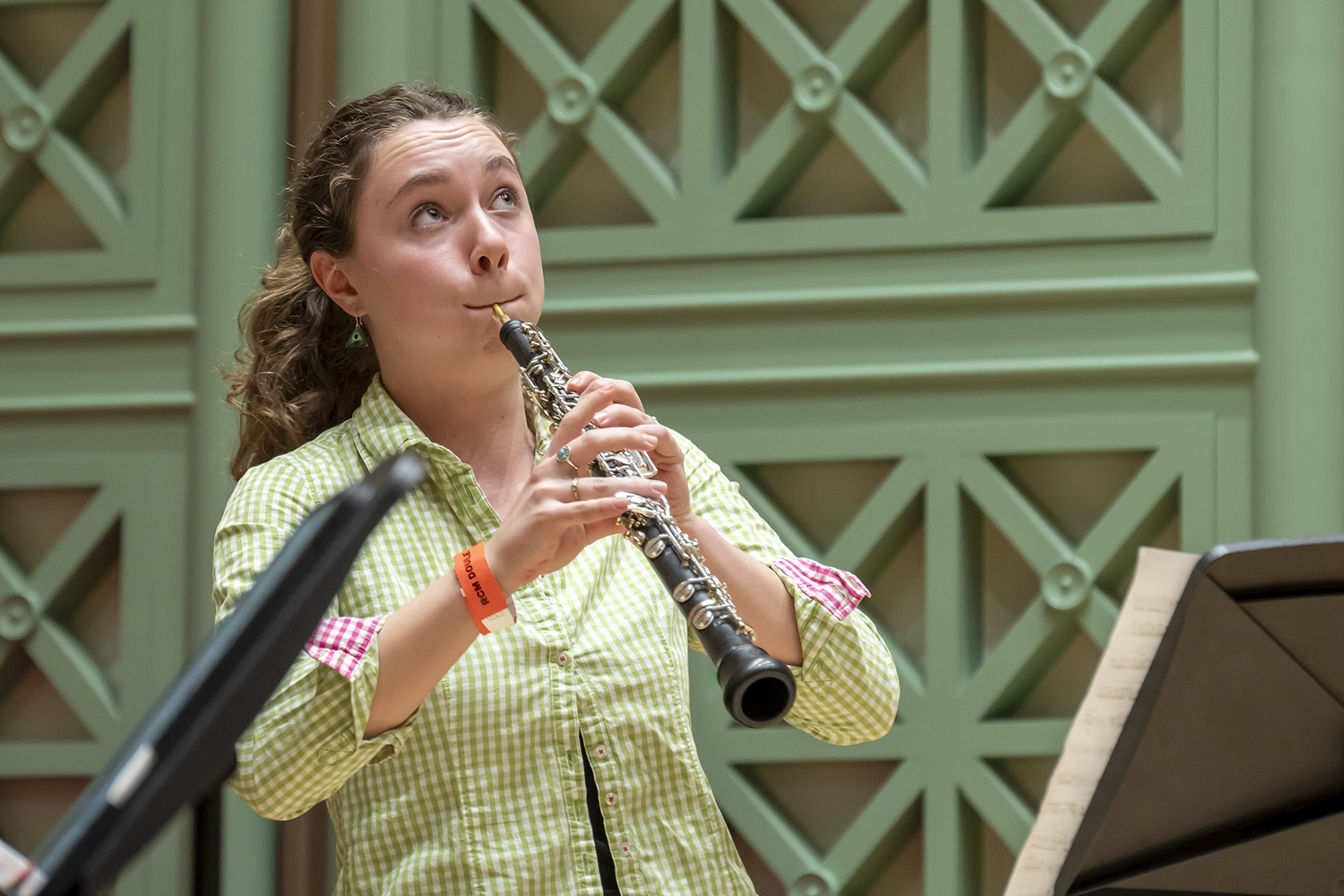 An oboist performing in the Royal College of Music's Performance Hall