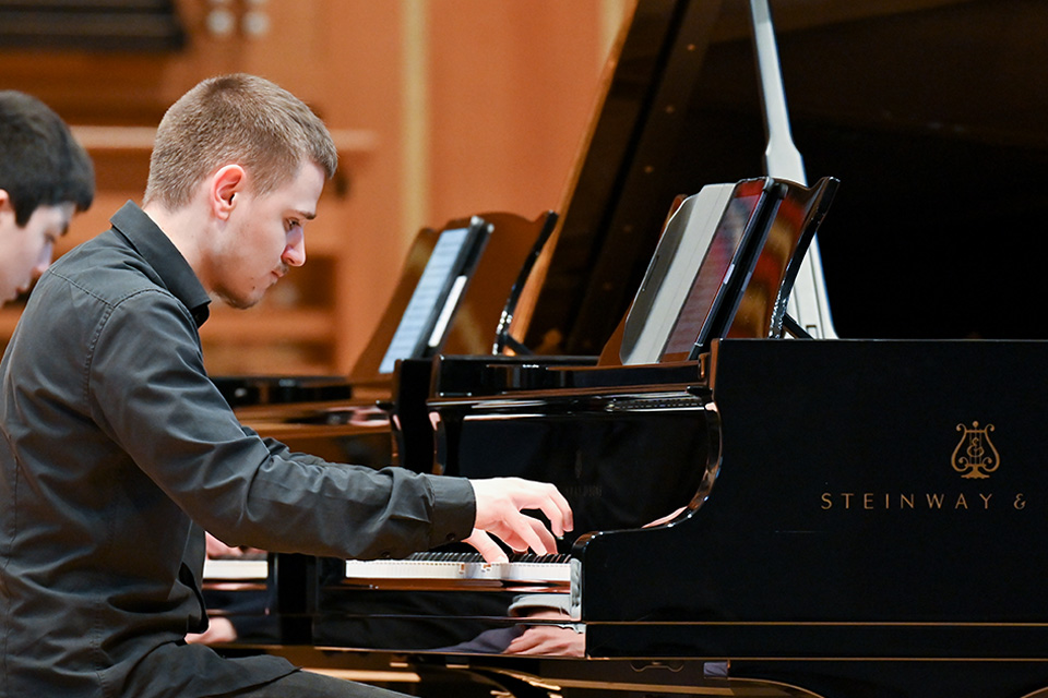 Student performing at the piano