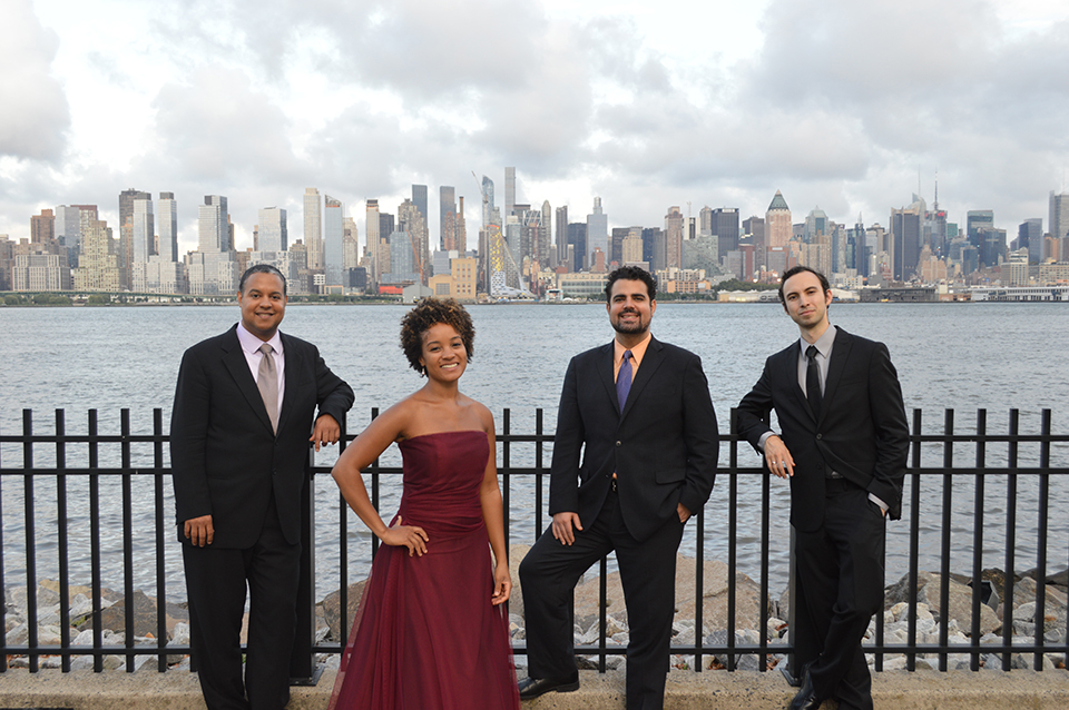 The Harlem Quartet standing in front of a city skyline