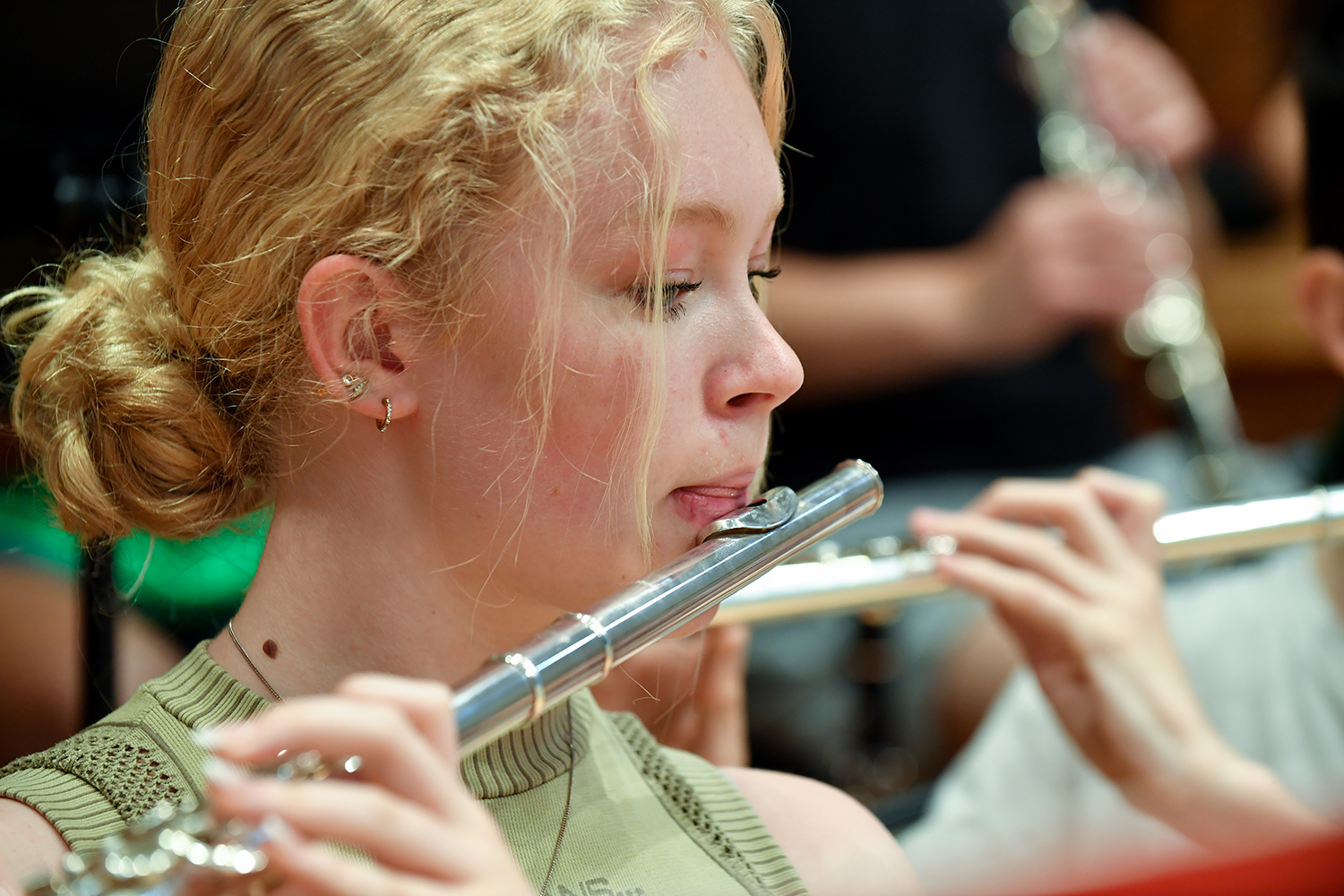 A young woman from the Junior Department performing on a flute