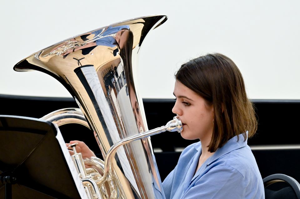 Close up of female tuba player