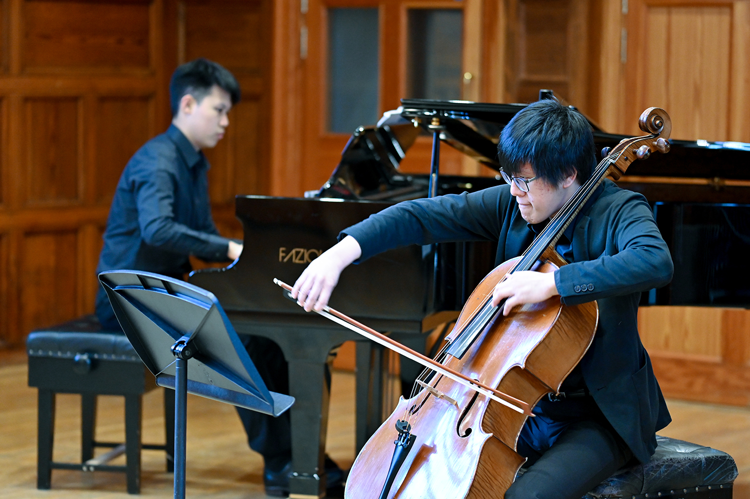 A cellist and a pianist performing in The Carne Room