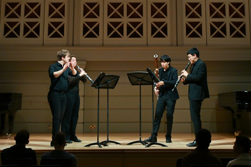 A group of musicians perform on stage