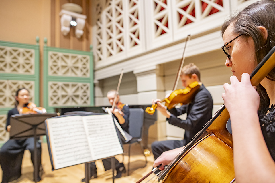 A quartet of string players in the RCM Performance Hall