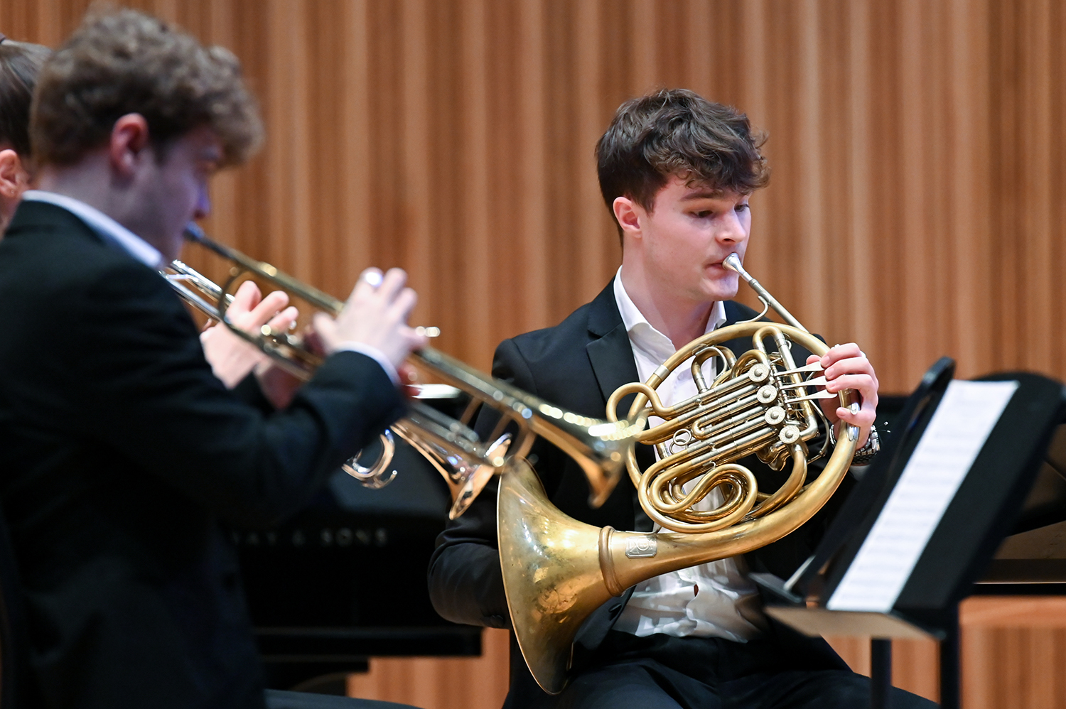 Brass musicians performing on stage