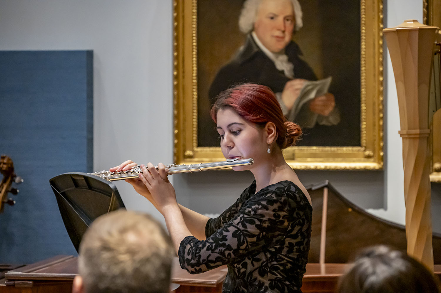 A flute player performing in the RCM Museum