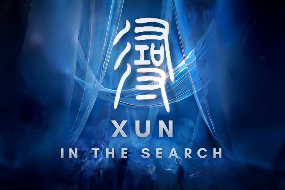 A graphic of blue light beams overlayed with text reading 'Xun In the Search'