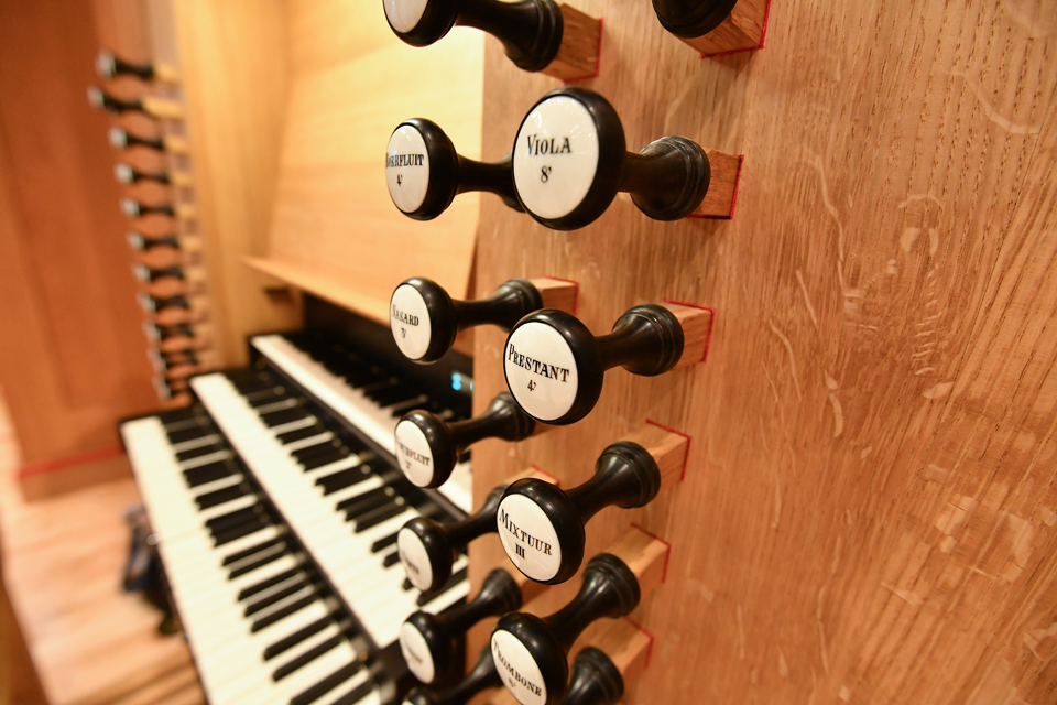 A close-up image showing the keys and stops on the Flentrop Orgelbouw organ