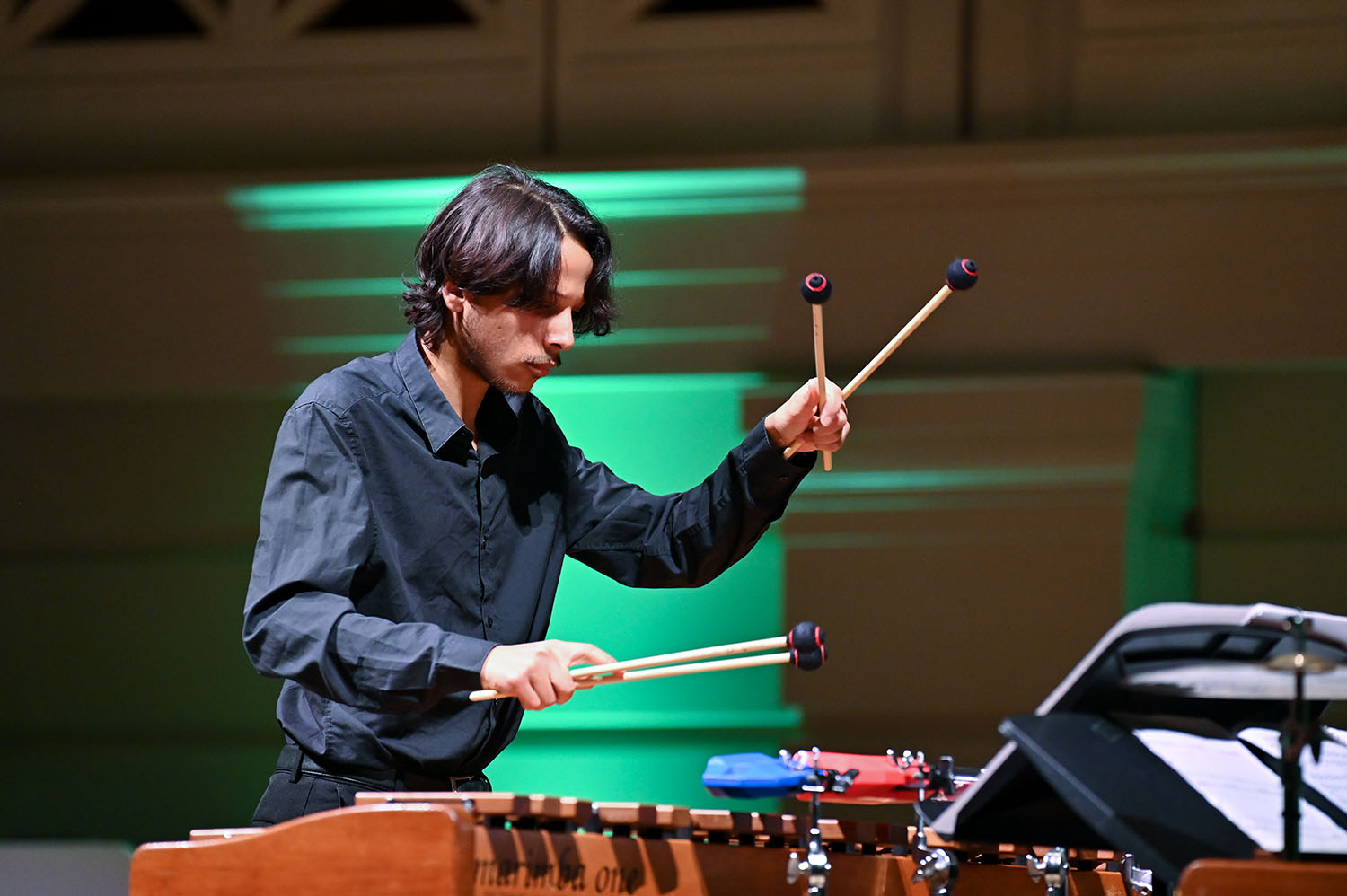A percussionist on stage in the Performance Hall