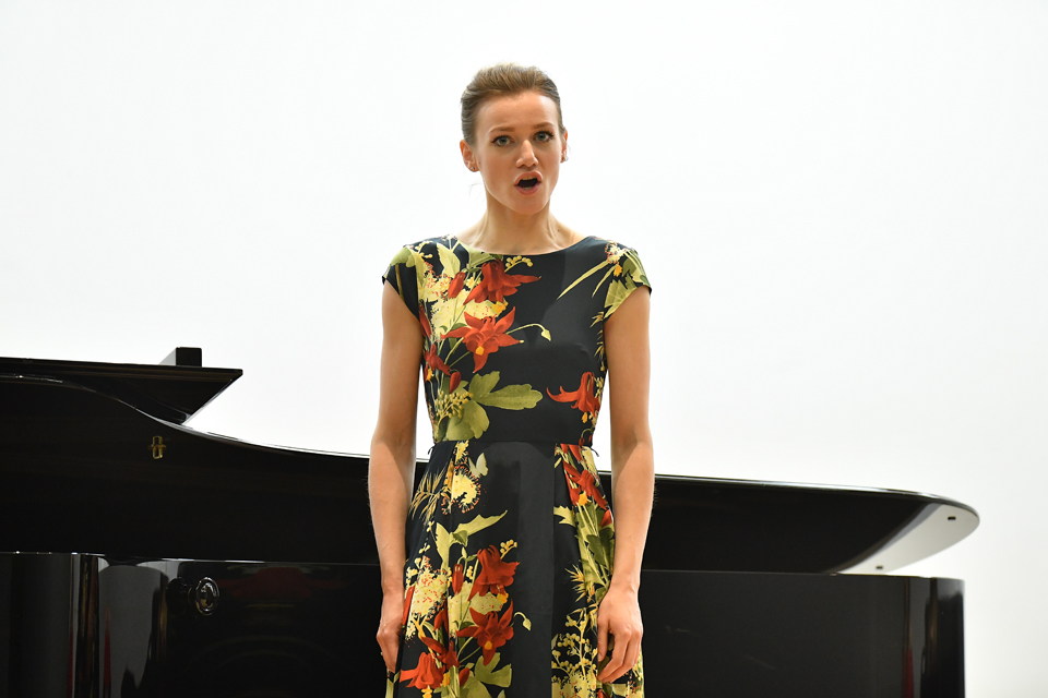 Female singer in a floral dress