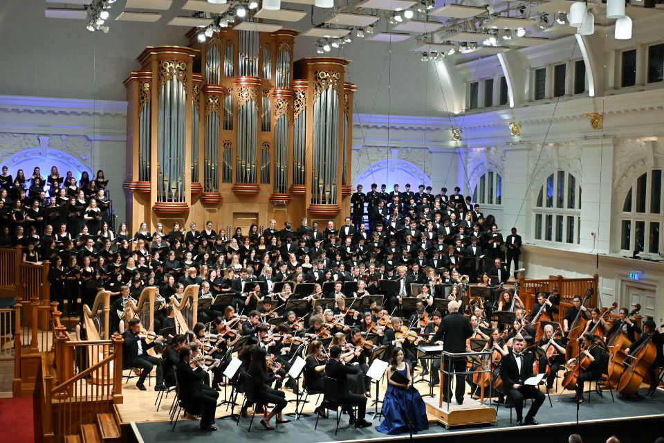 The RCM Symphony Orchestra and Chorus fill the stage of the Amaryllis Fleming Concert Hall