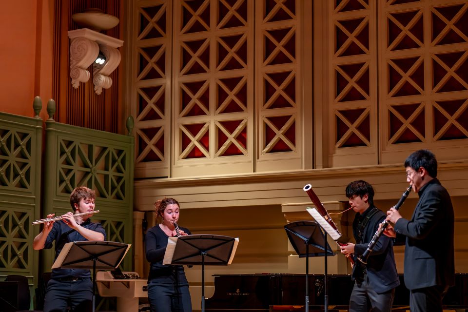 A woodwinf quartet performs on the Performance Hall stage
