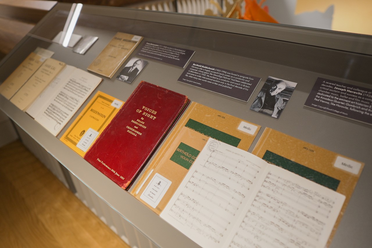 A display of sheet music books in an exhibition at the RCM Museum.
