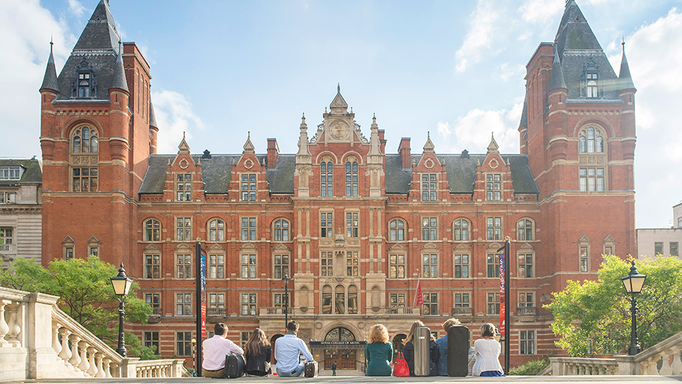 A row of RCM students sat looking at the RCM's Blomfield building